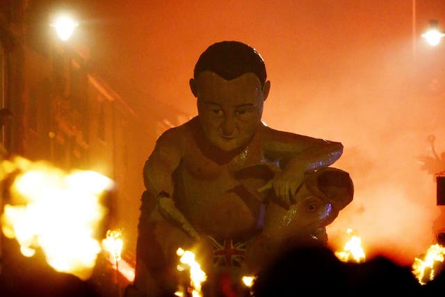 An effigy of Prime Minister David Cameron being paraded through the town of Lewes in East Sussex