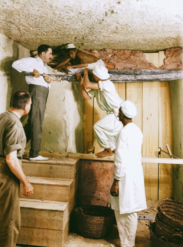 Carter, Callende, and two workers remove the partition wall between the antechamber and the burial chamber, 2nd December 1923. Image courtesy of Griffith Institute, University of Oxford, colourised by Dynamichrome