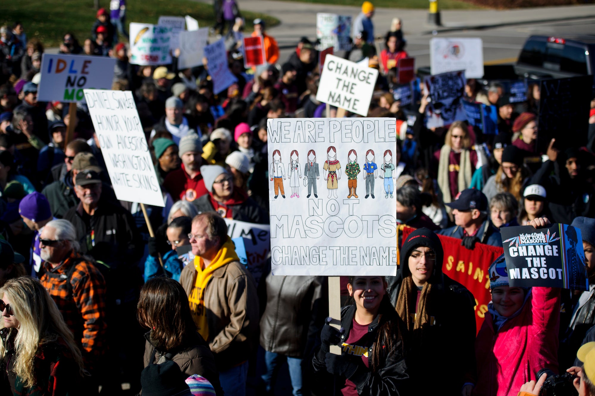 People march to protest against the Washington NFL team in Minneapolis, Minnesota.