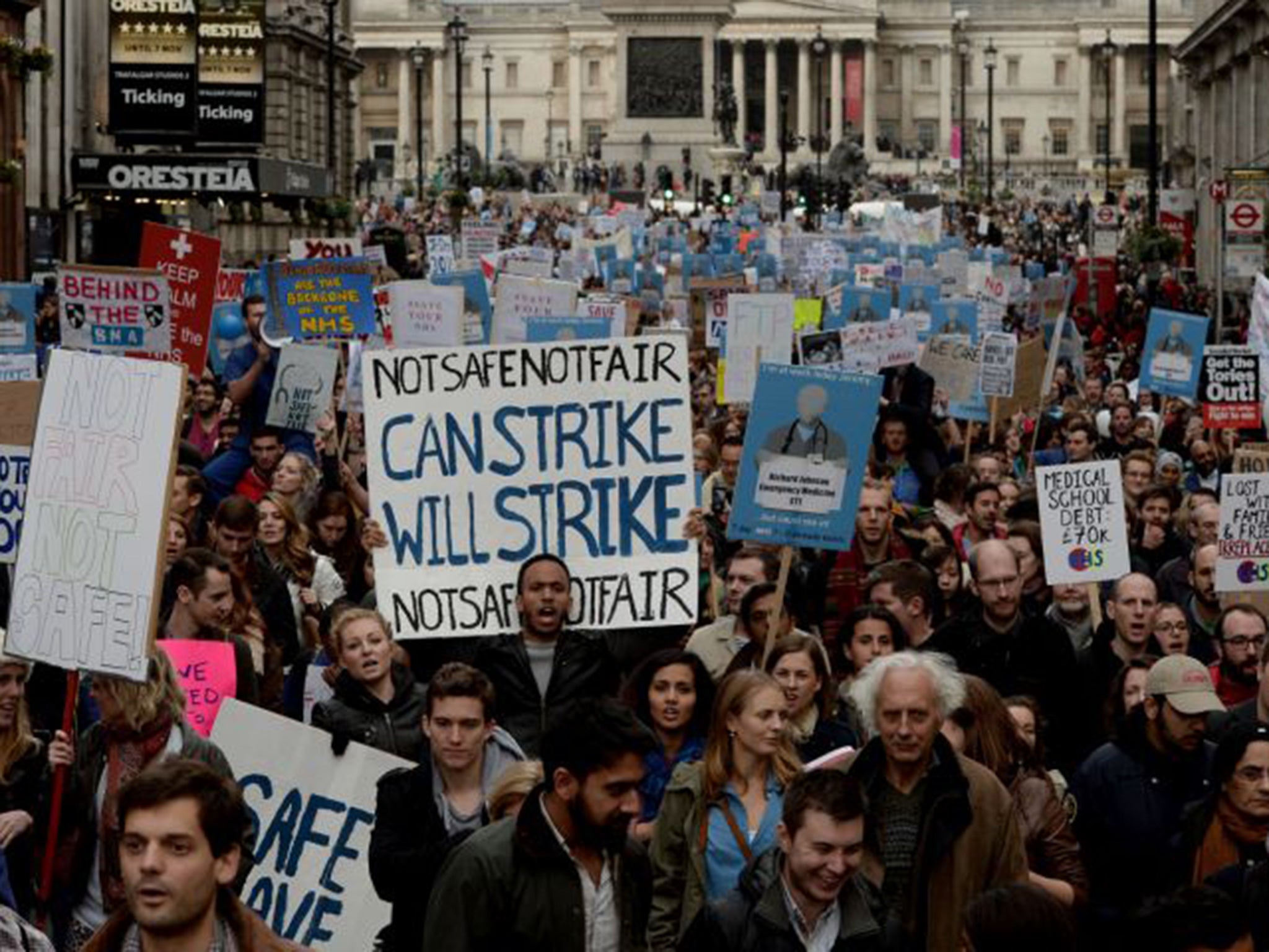 Demonstrators march down Whitehall during the 'Let's Save the NHS' rally in October