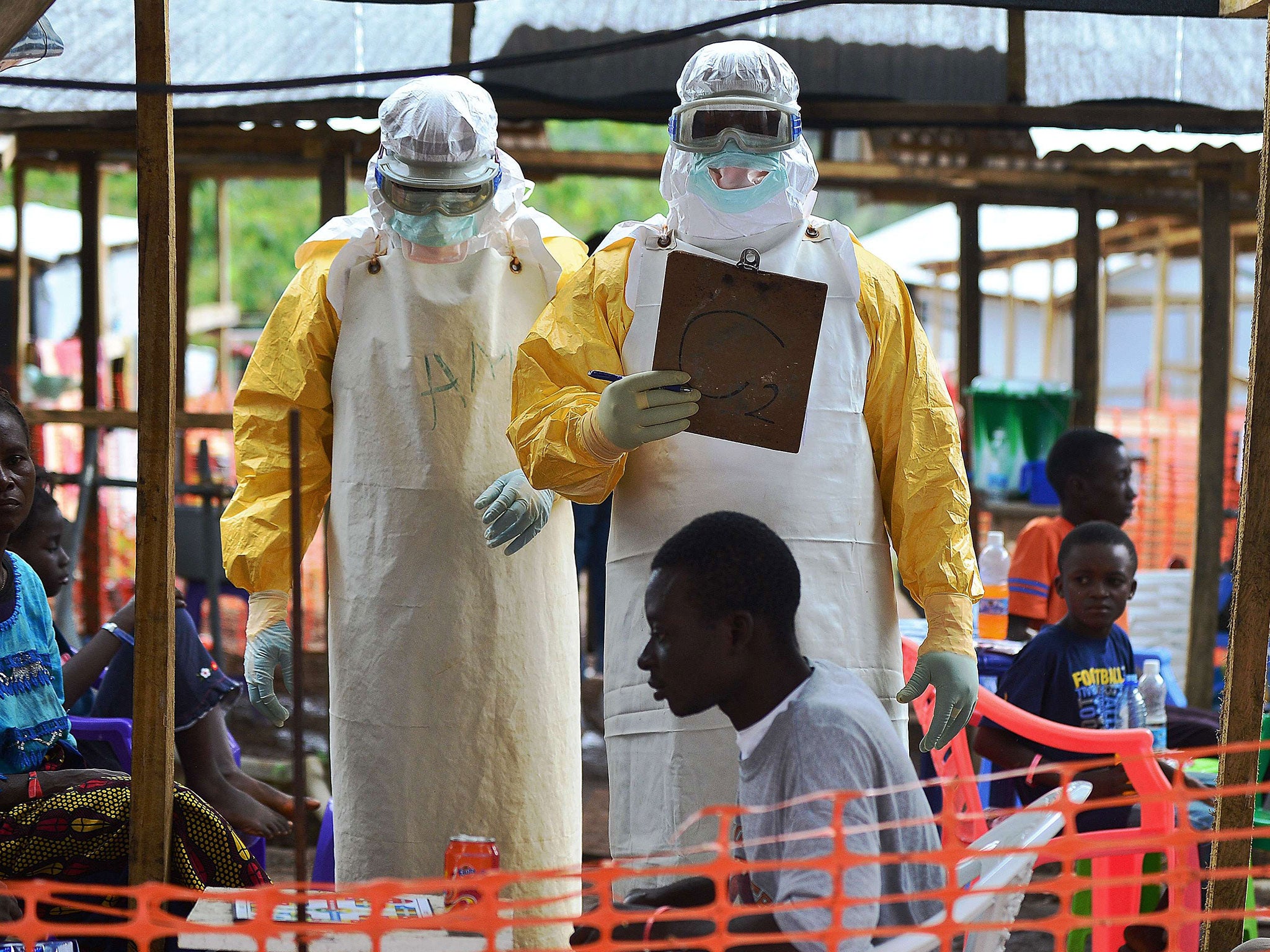 MSF volunteers work during the Ebola outbreak in August