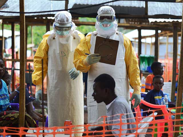 MSF volunteers work during the Ebola outbreak in August