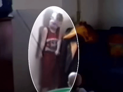 Gavin Walla is seen in the video hanging, unable to breathe, on the cord before being rescued by his mother