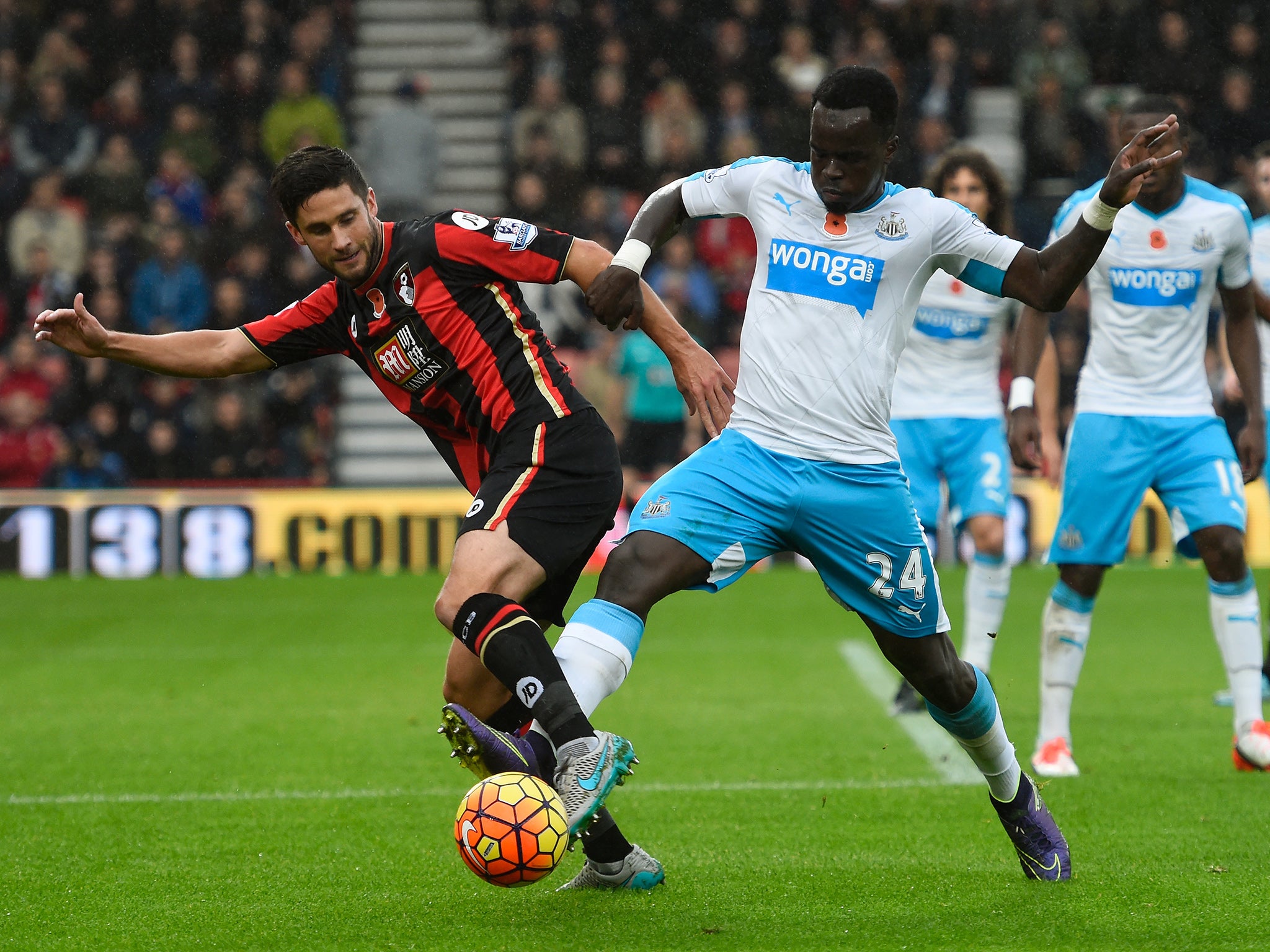 Chieck Tiote challenges Andrew Surman for the ball