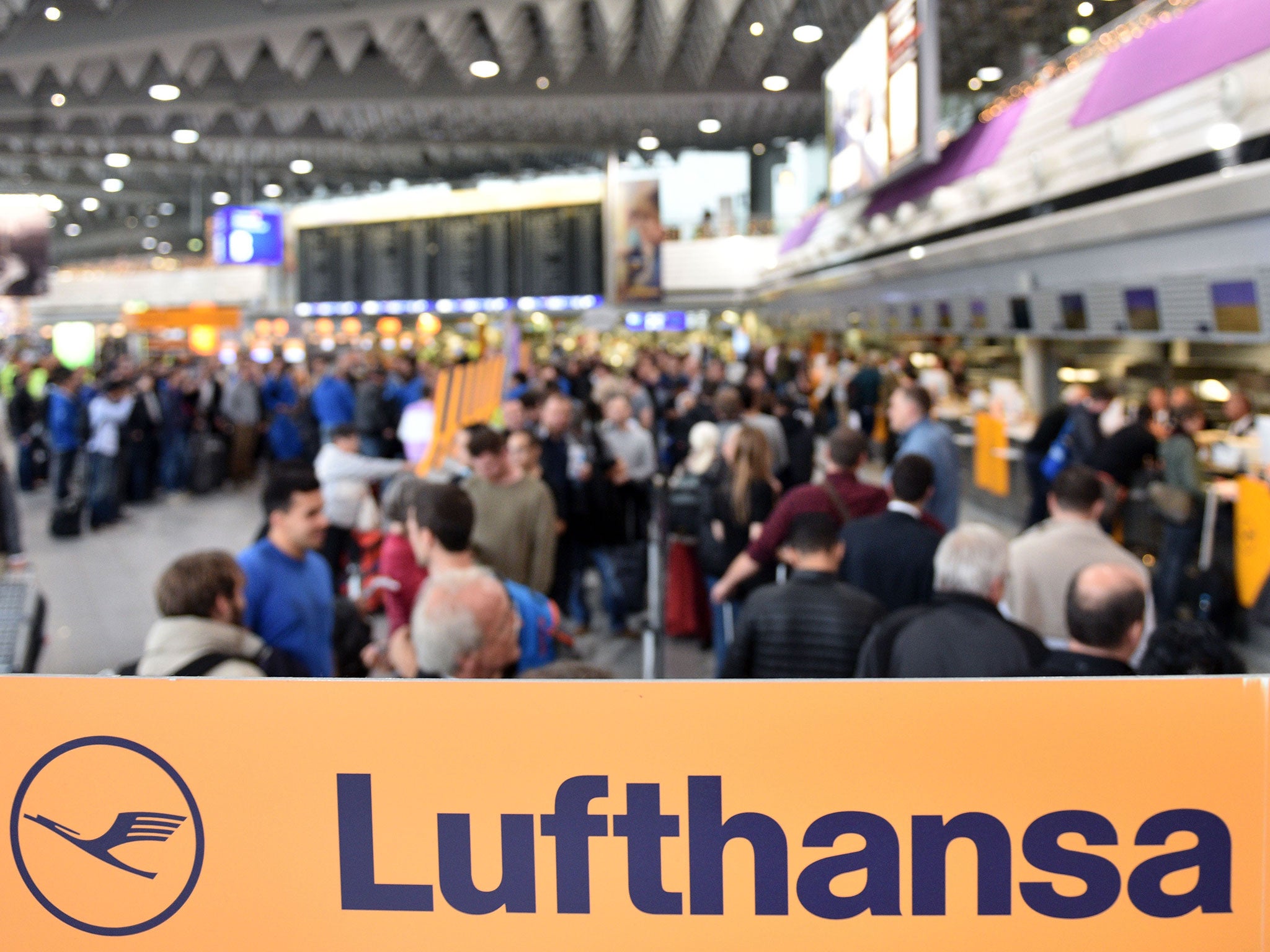 Passengers wait at Frankfurt Airport during an strike over salaries on November 6, 2015 in Frankfurt, Germany