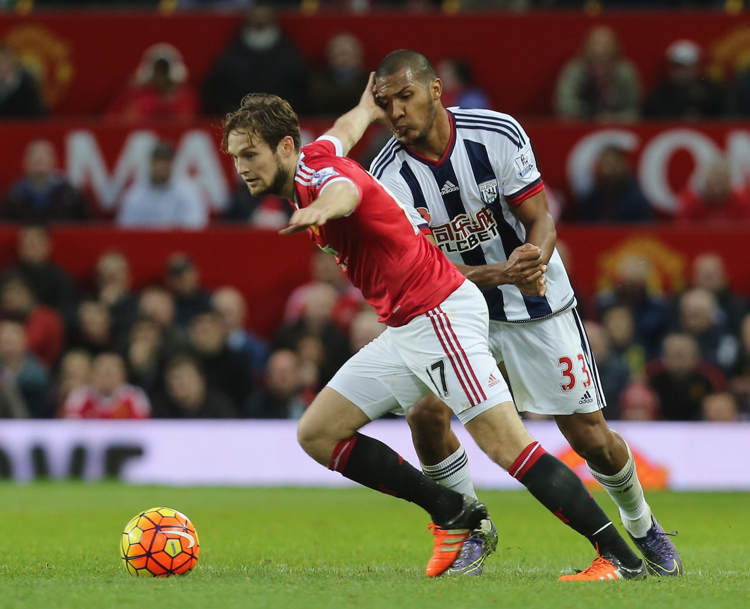 Salomon Rondon wrestles for possession with Daley Blind