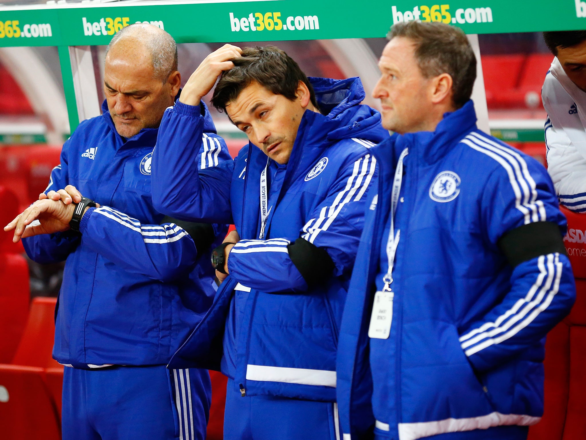 Chelsea's assistant first team coaches Steve Holland (R), Rui Faria and Silvino Louro on a Mourinho-less bench prior to kick off