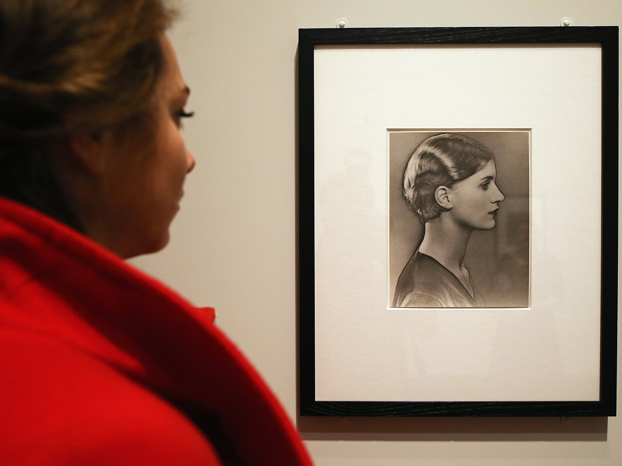 A visitor looks at a photograph of Lee Miller, by Man Ray at the National Portrait Gallery on February 6, 2013 in London, England