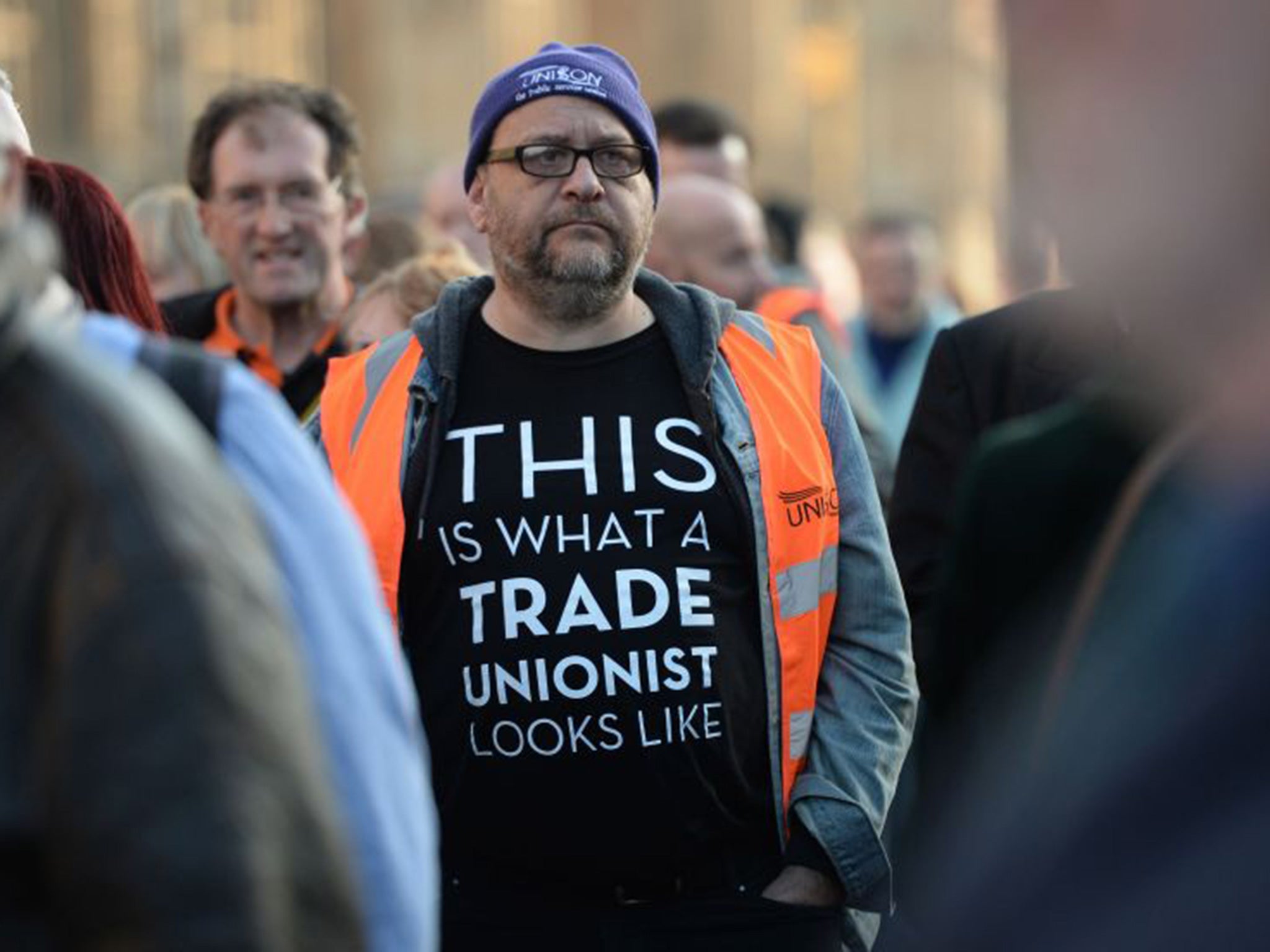 TUC members queue outside the Houses of Parliament to lobby against the Trade Union