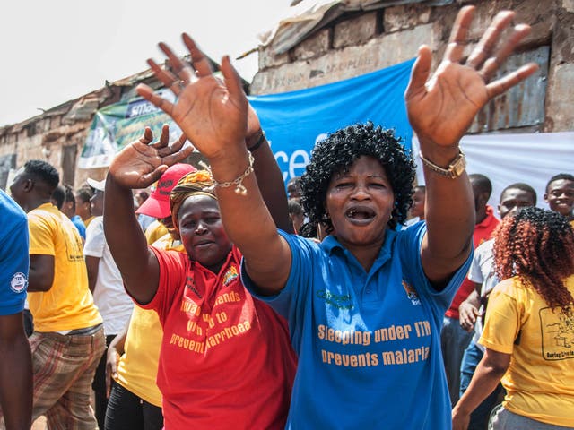 Women celebrate as Sierra Leone is declared Ebola free in the capital of Freetown on 7 November