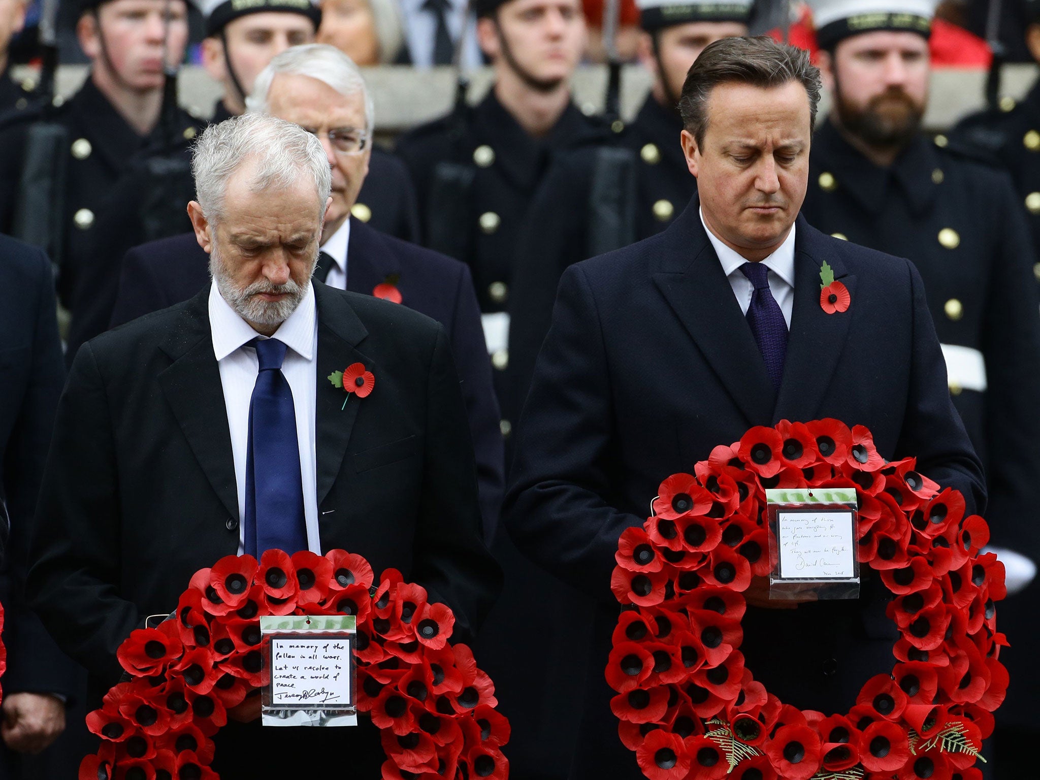 Labour party leader Jeremy Corbyn (left) and Prime Minister David Cameron wait to lay wreaths during the annual Remembrance Sunday service at the Cenotaph memorial in Whitehall, central London