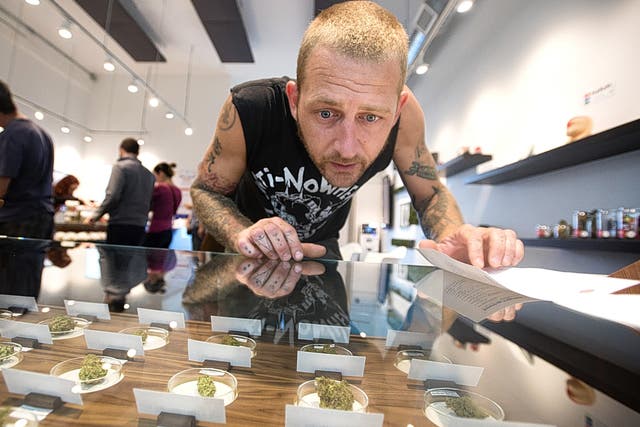 A man shops at a marijuana dispensary in Portland, Oregon, one of four US states which permit recreational use of the drug