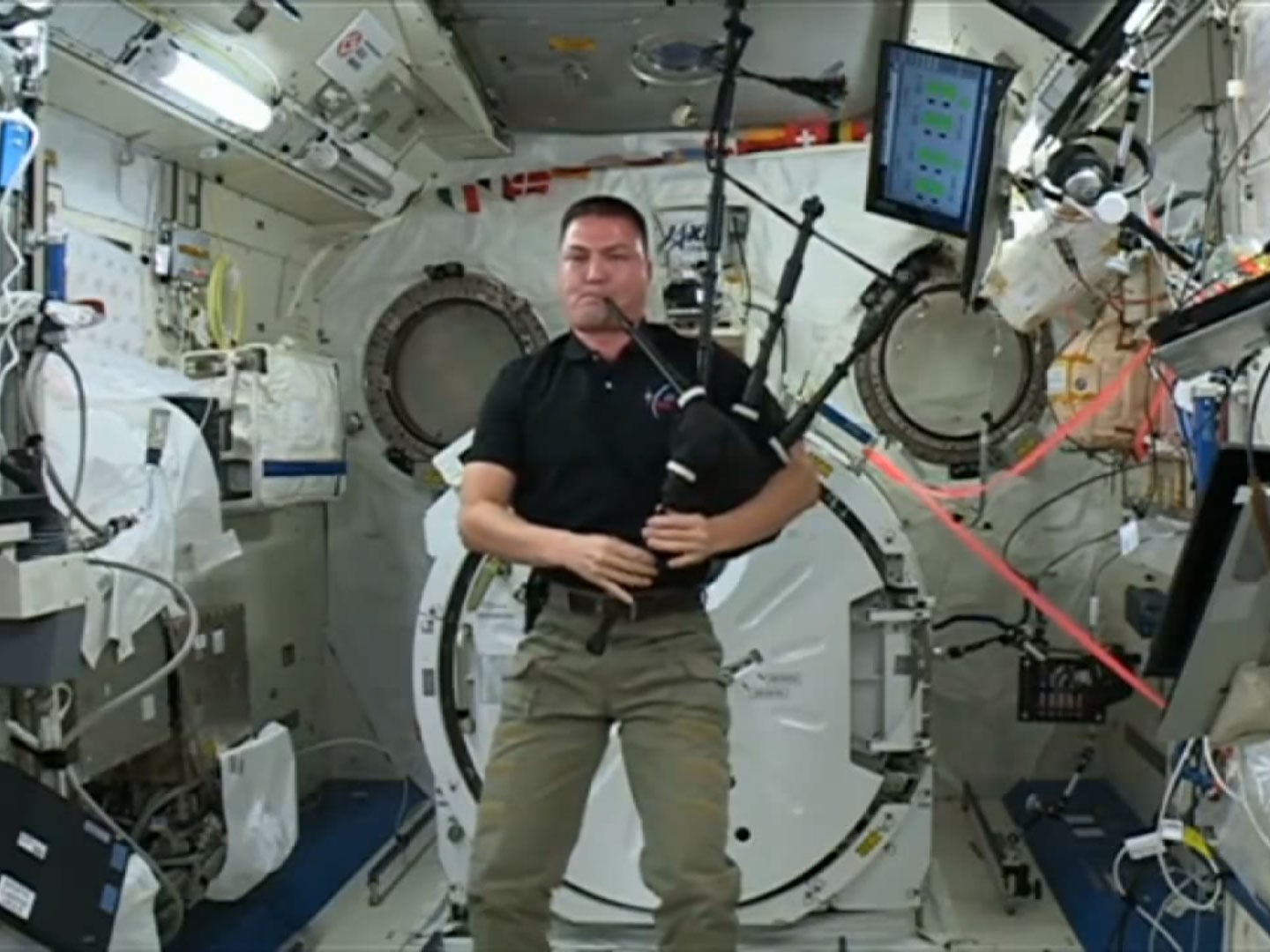 Nasa flight engineer Kjell Lindgren plays the bagpipes in space for the first time