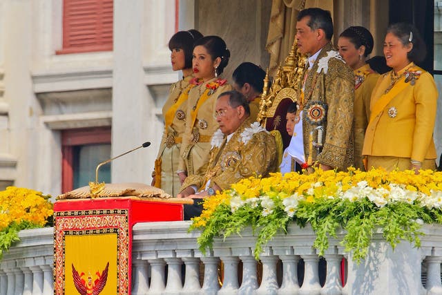 Thailand's King Bhumibol Adulyadej, surrounded by his daughters and his son, Crown Prince Vajiralongkorn,