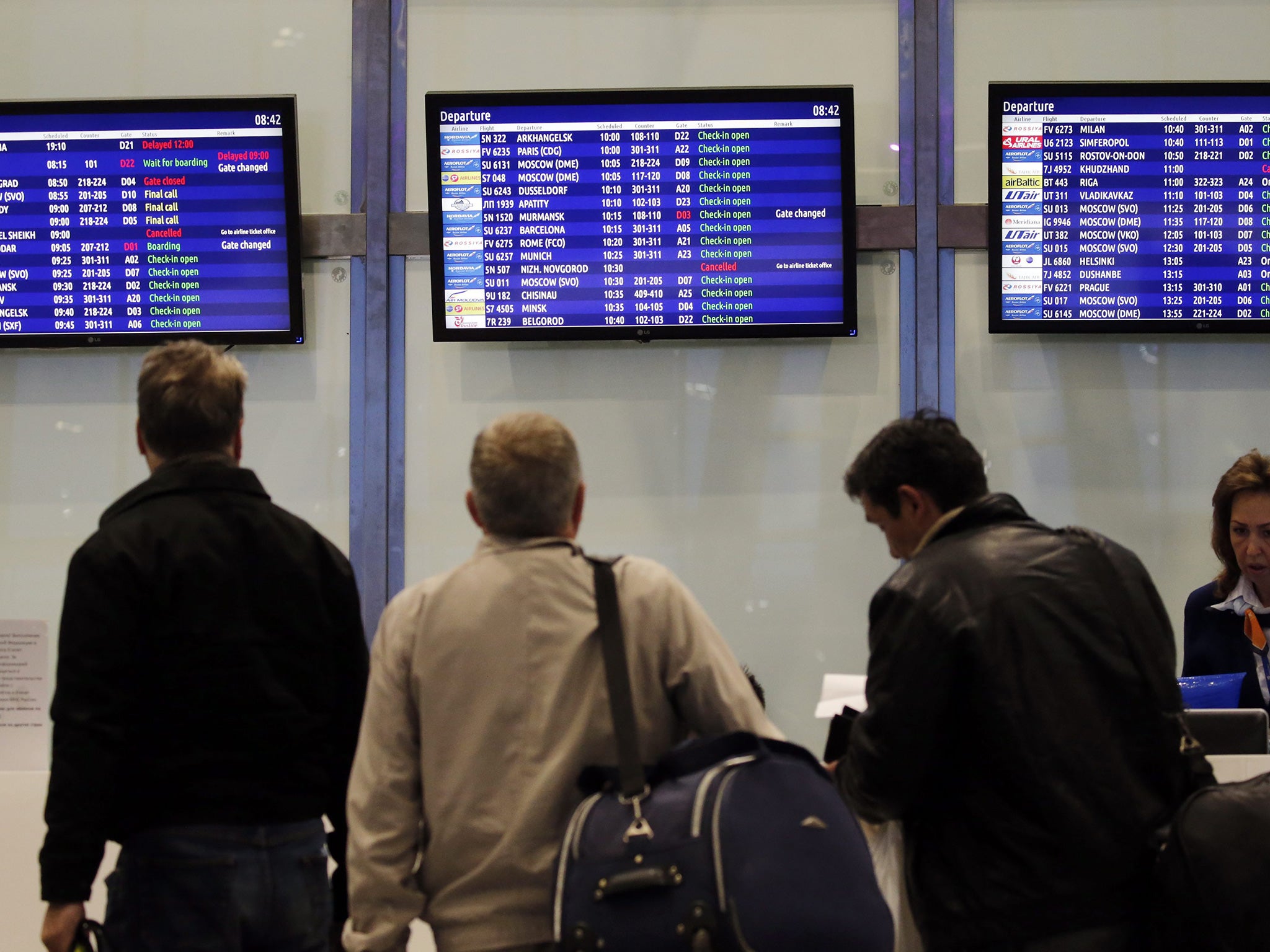 Passengers check monitors as flights to Sharm el-Sheikh appear as cancelled at Pulkovo airport in St. Petersburg, Russia on 7 November