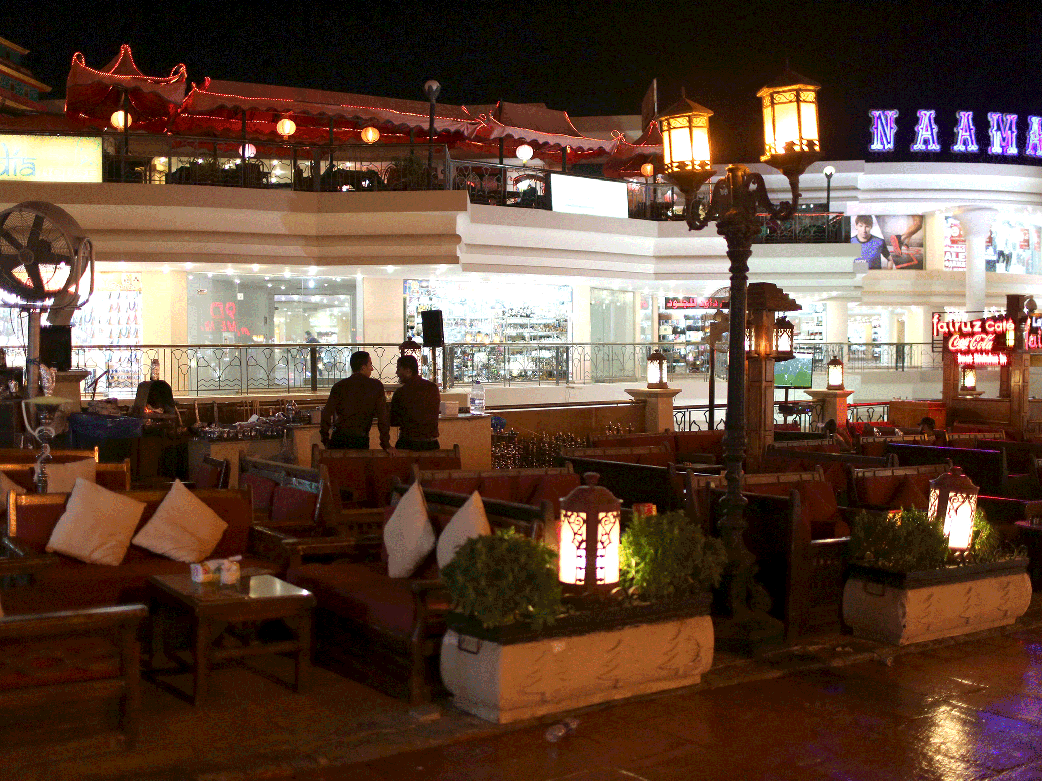 Employees wait for customers at a cafe in Naama bay area at the Red Sea resort of Sharm el-Sheikh, November 8, 2015.