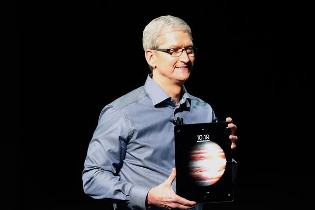 Apple CEO Tim Cook holds the hefty iPad Pro at its unveiling in September 2015
