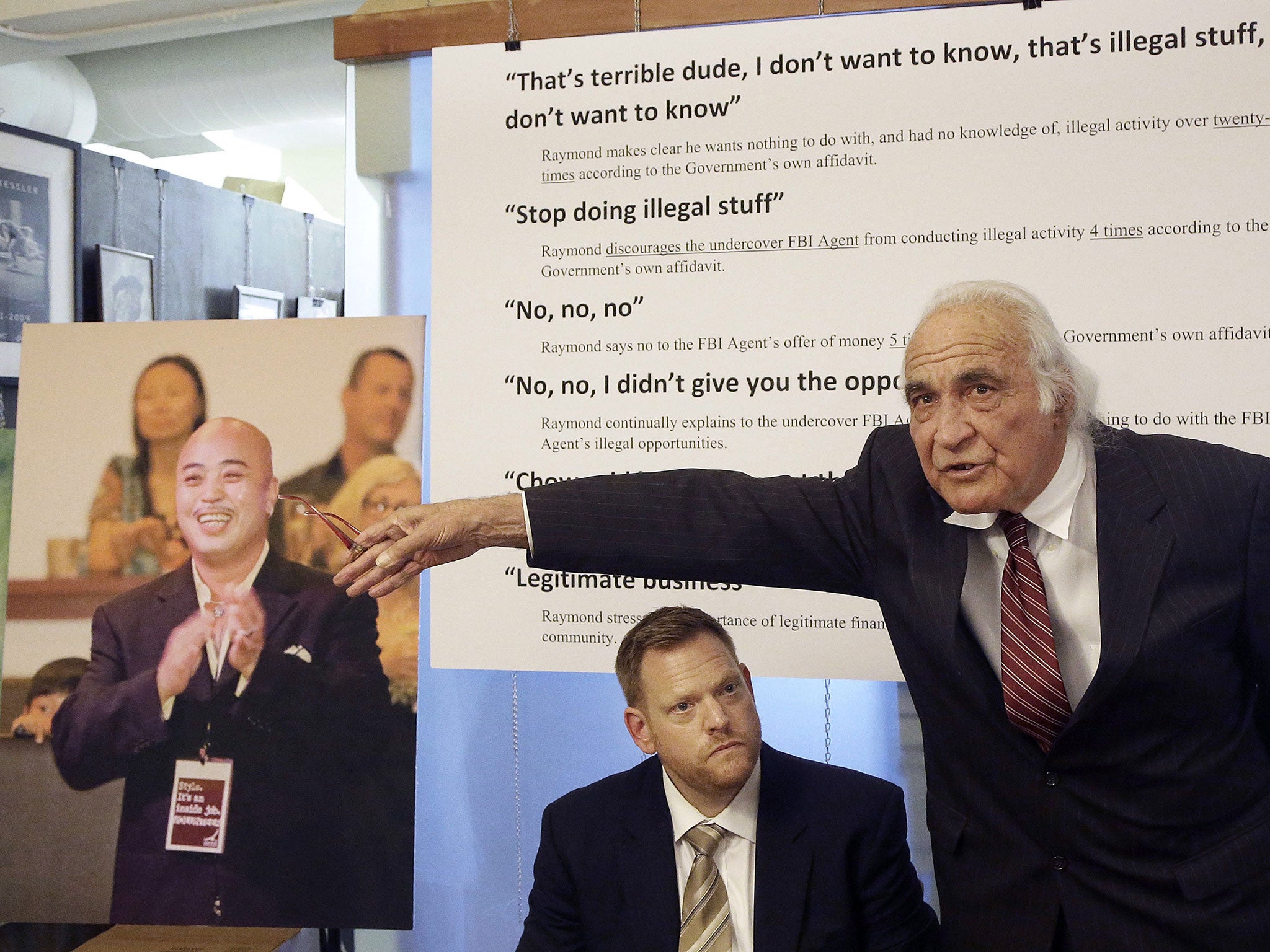 File: Tony Serra, right, speaks next to Curtis Briggs, both attorneys for Raymond 'Shrimp Boy' Chow, pictured at left, during a news conference in San Francisco on 10 April, 2014
