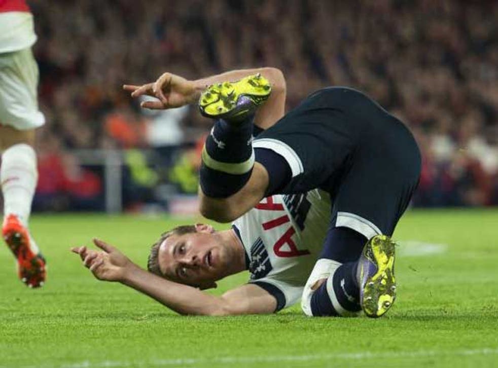 Tottenham striker Harry Kane tumbles over at the Emirates on Sunday