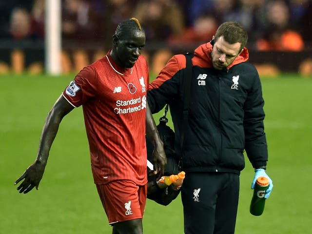 Liverpool defender Mamadou Sakho limps off the field against Crystal Palace