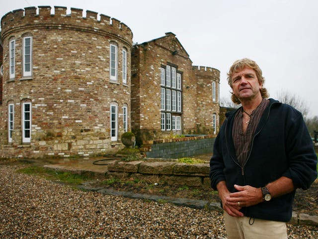 Robert Fidler outside the mock Tudor castle home that he built without planning permission in 2000 at Honeycrock Farm, Salfords, Surrey