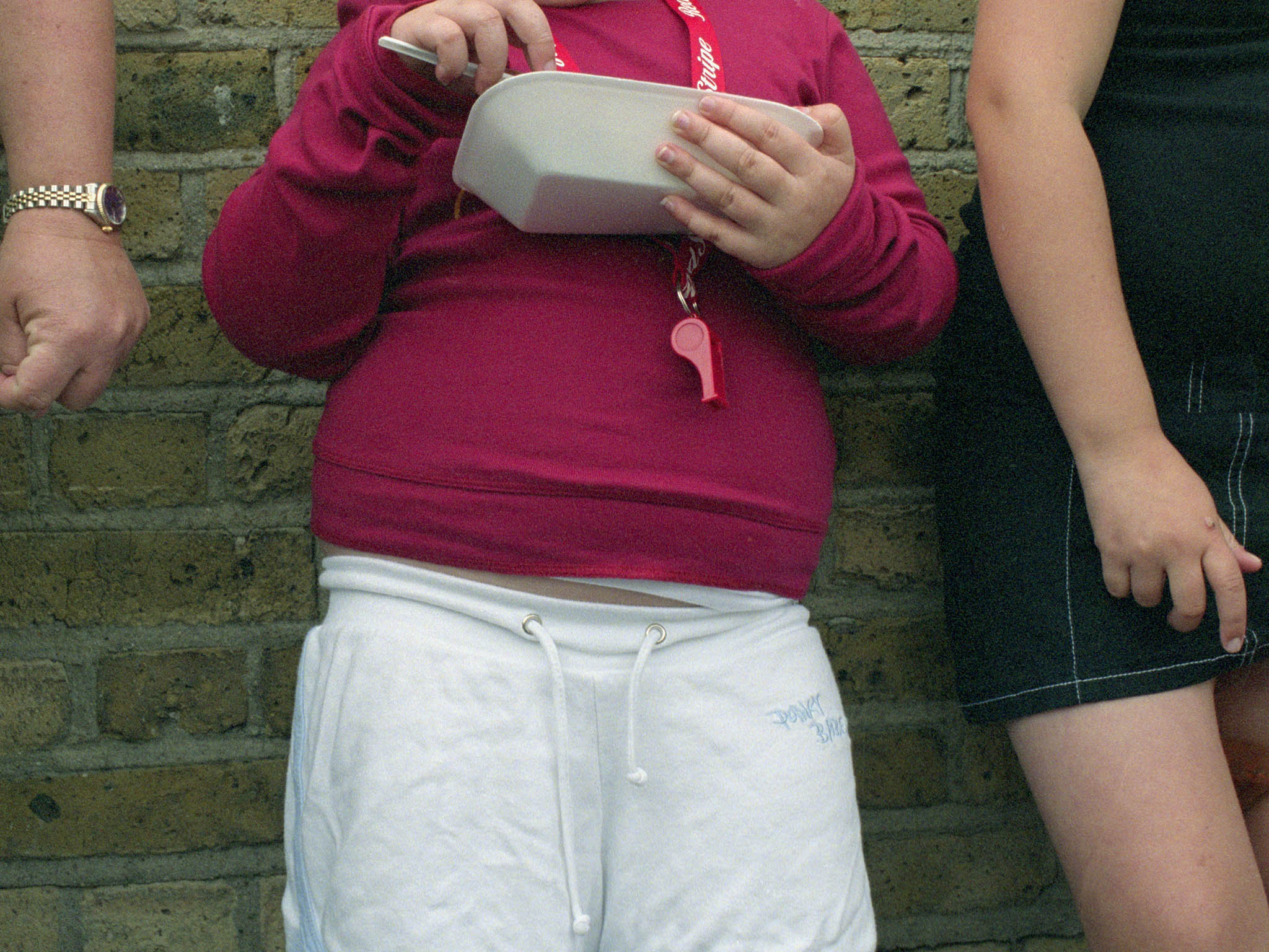 Overweight child eating chips