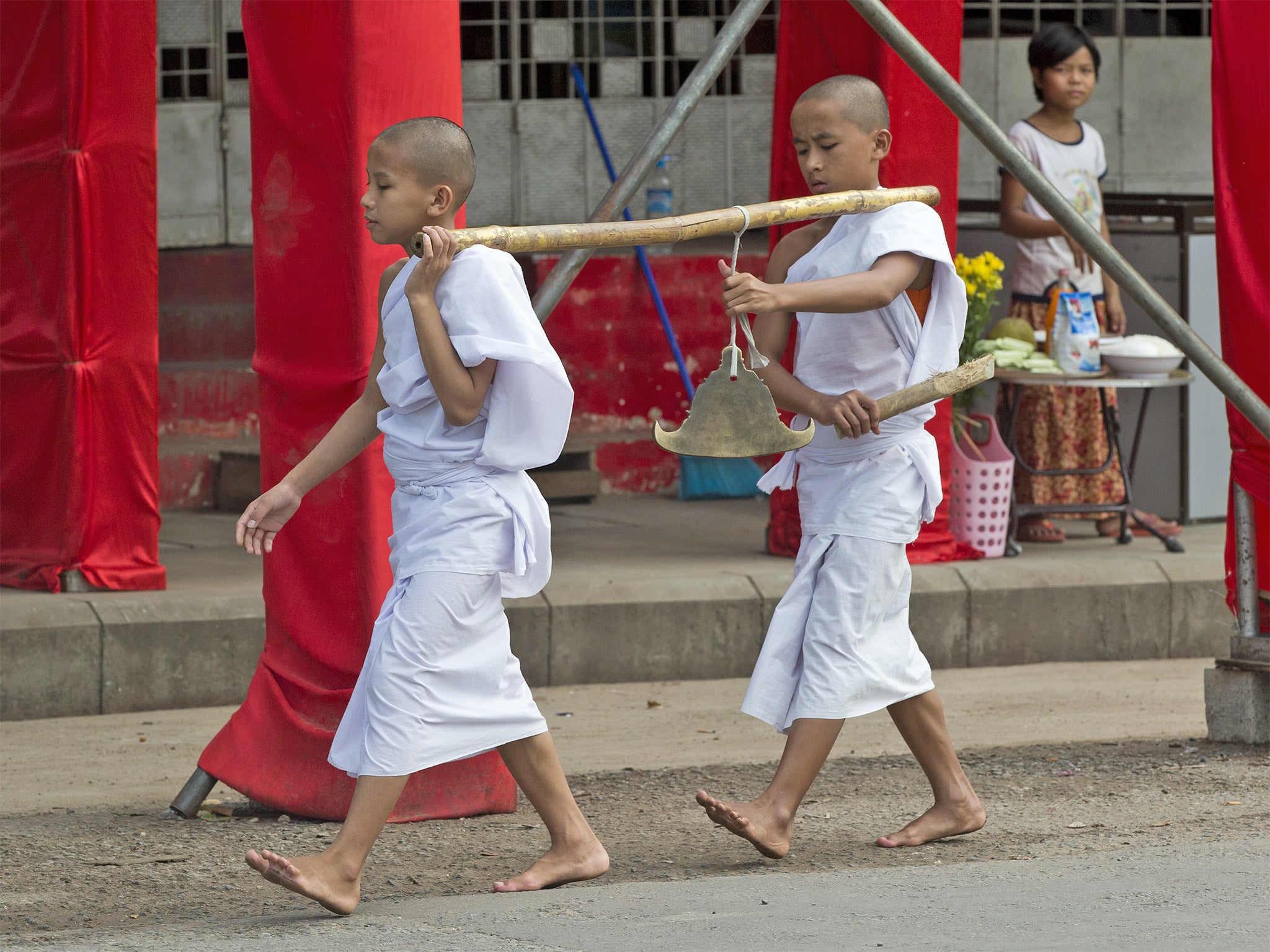 Novice Buddhist monks outside the offices of Burma’s victorious opposition party, the National League for Democracy, in Rangoon on Tuesday