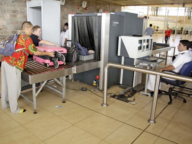 Security officials screen luggage at Sharm el-Sheikh Airport