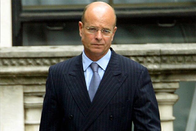 Retired spy boss Sir John Scarlett, pictured leaving the Hutton inquiry in 2003