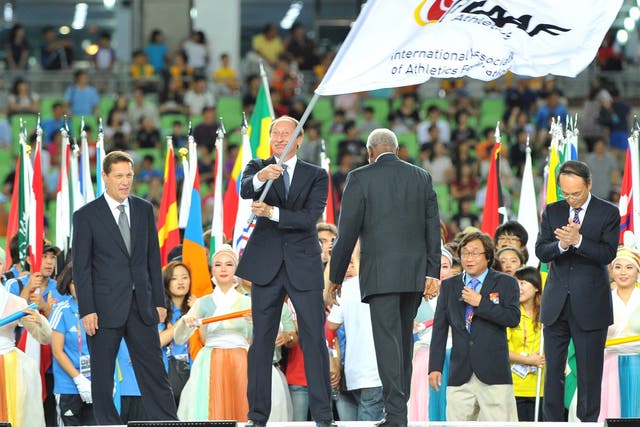 Valentin Balakhnichev, former head of the Russian Athletics Federation, waves the IAAF flag at the 2011 World Championships in Daegu