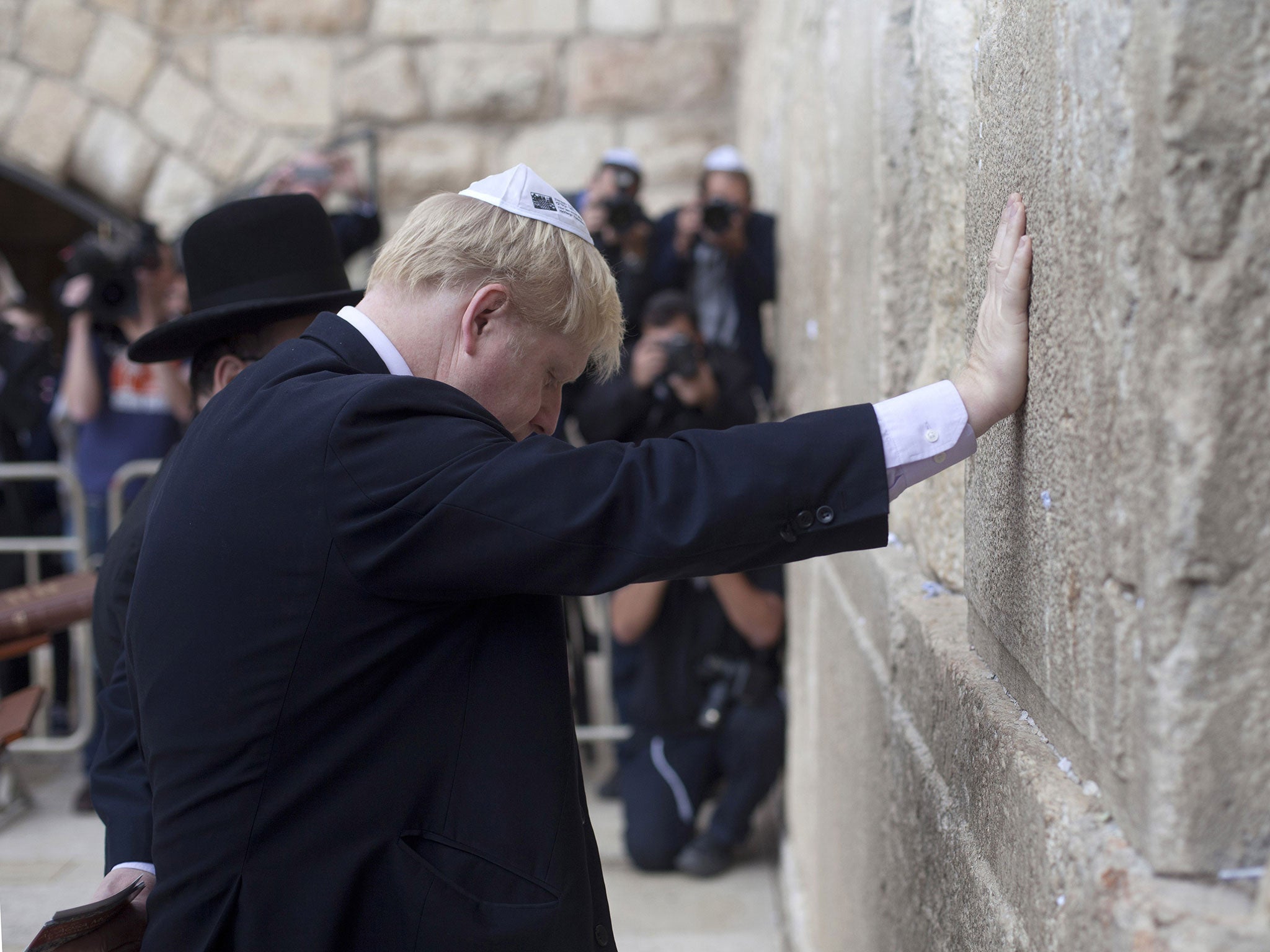 Mayor of London, Boris Johnson prays at the Western Wall, Judaism's holiest site, on November 11, 2015 in Jerusalem's Old City, Israel.