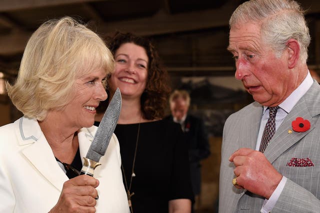Camilla jokingly waves knife at Prince Charles during Australia tour