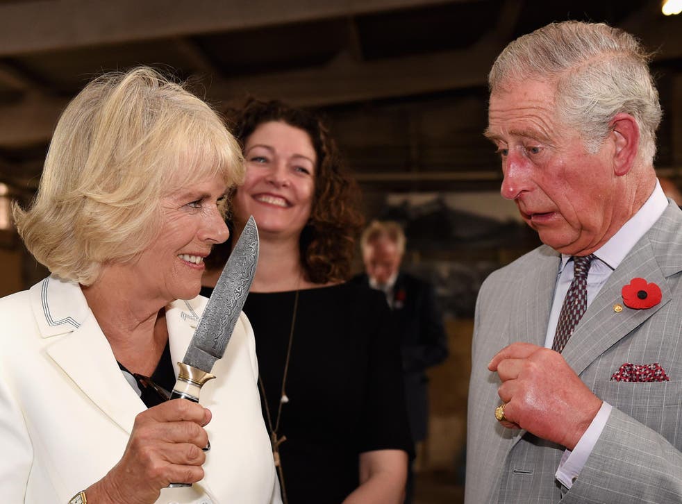 Camilla jokingly waves knife at Prince Charles during Australia tour