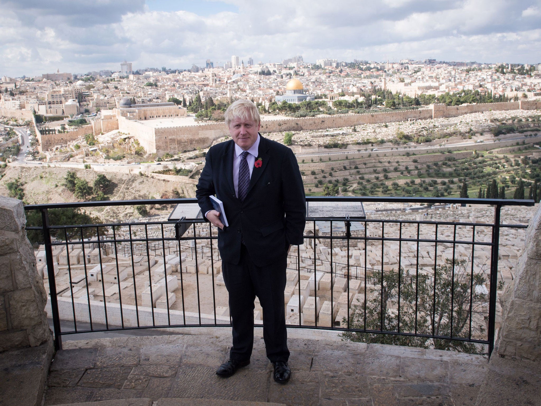Mayor of London Boris Johnson looks out over the Old City of Jerusalem during his the last day of his visit on 11 November