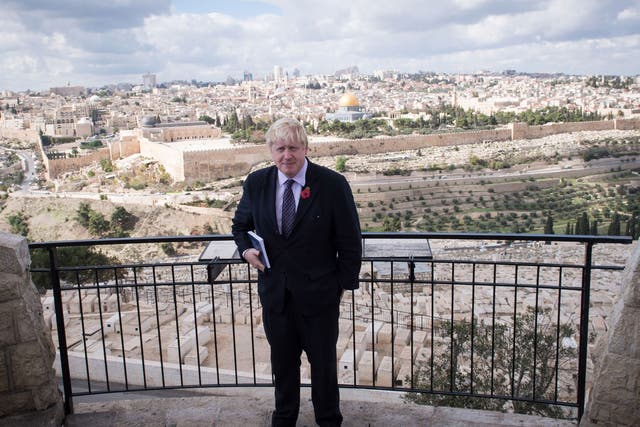Mayor of London Boris Johnson looks out over the Old City of Jerusalem during his the last day of his visit on 11 November
