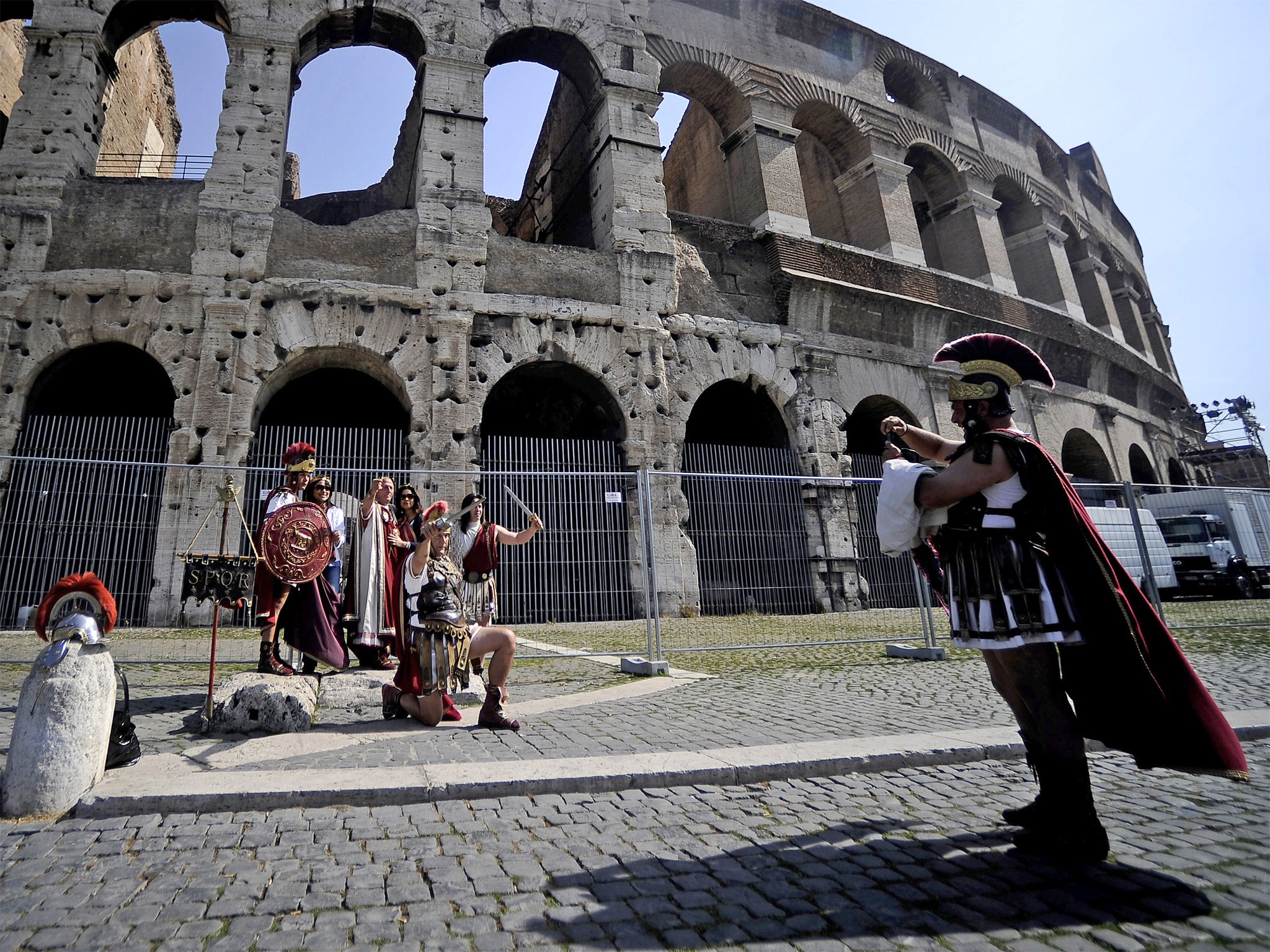 ‘Street artists’ dressed as centurions target tourists outside the Colosseum