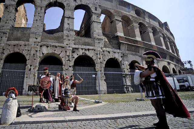 ‘Street artists’ dressed as centurions target tourists outside the Colosseum
