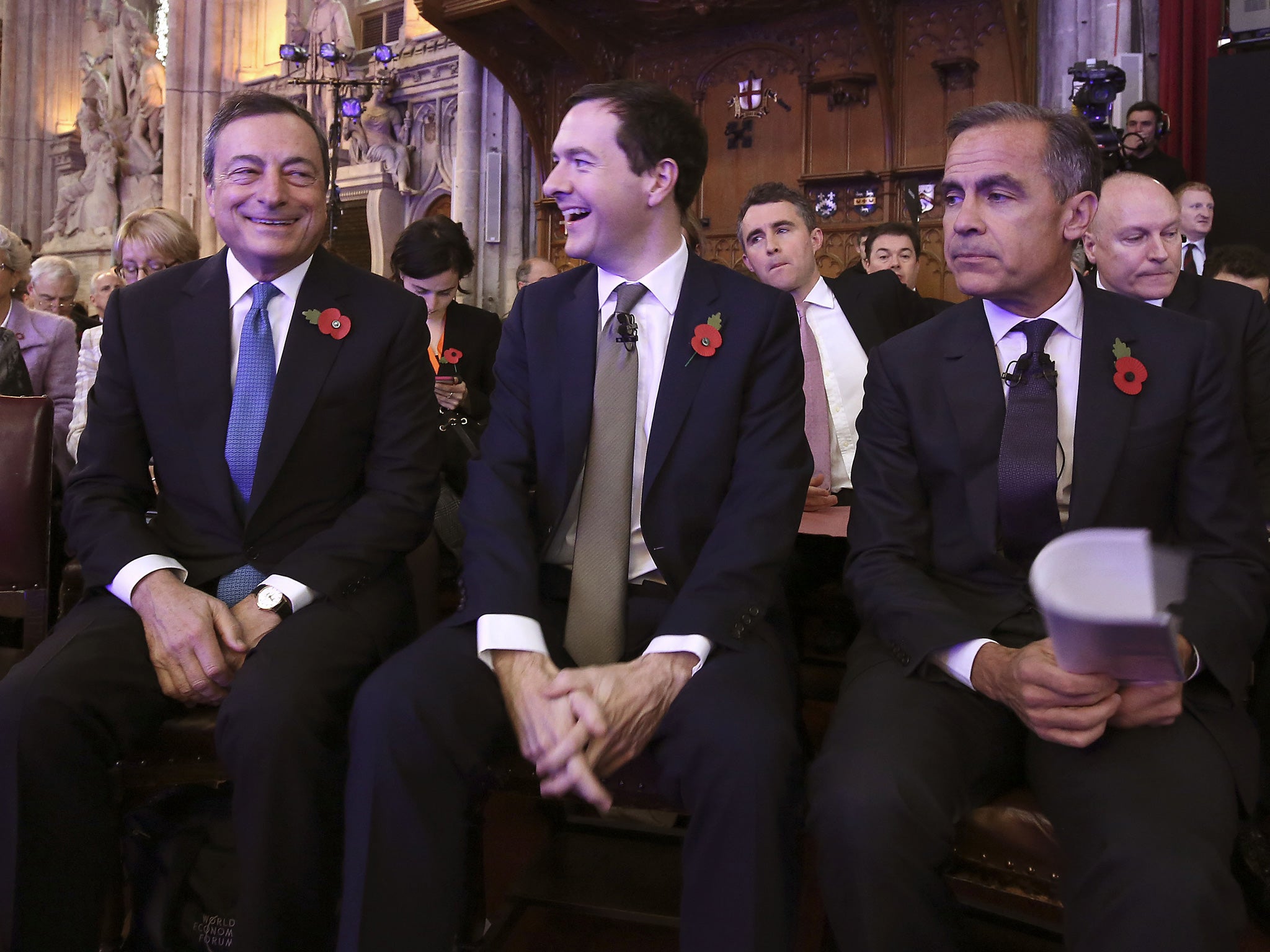 President of the European Central bank Mario Draghi, Chancellor George Osborne and the Bank of England governor Mark Carney at the Bank of England Open Forum 2015 at Guildhall in London.