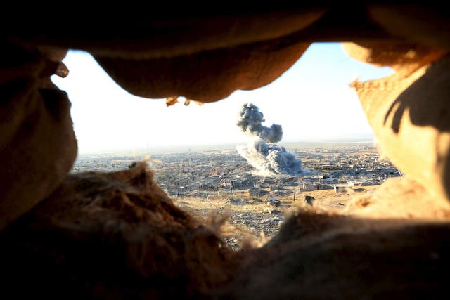 Smoke rises from the site of U.S.-led air strikes in the town of Sinjar, November 12, 2015. Kurdish forces launched an offensive on Thursday to retake the northern Iraqi town of Sinjar from Isis militants