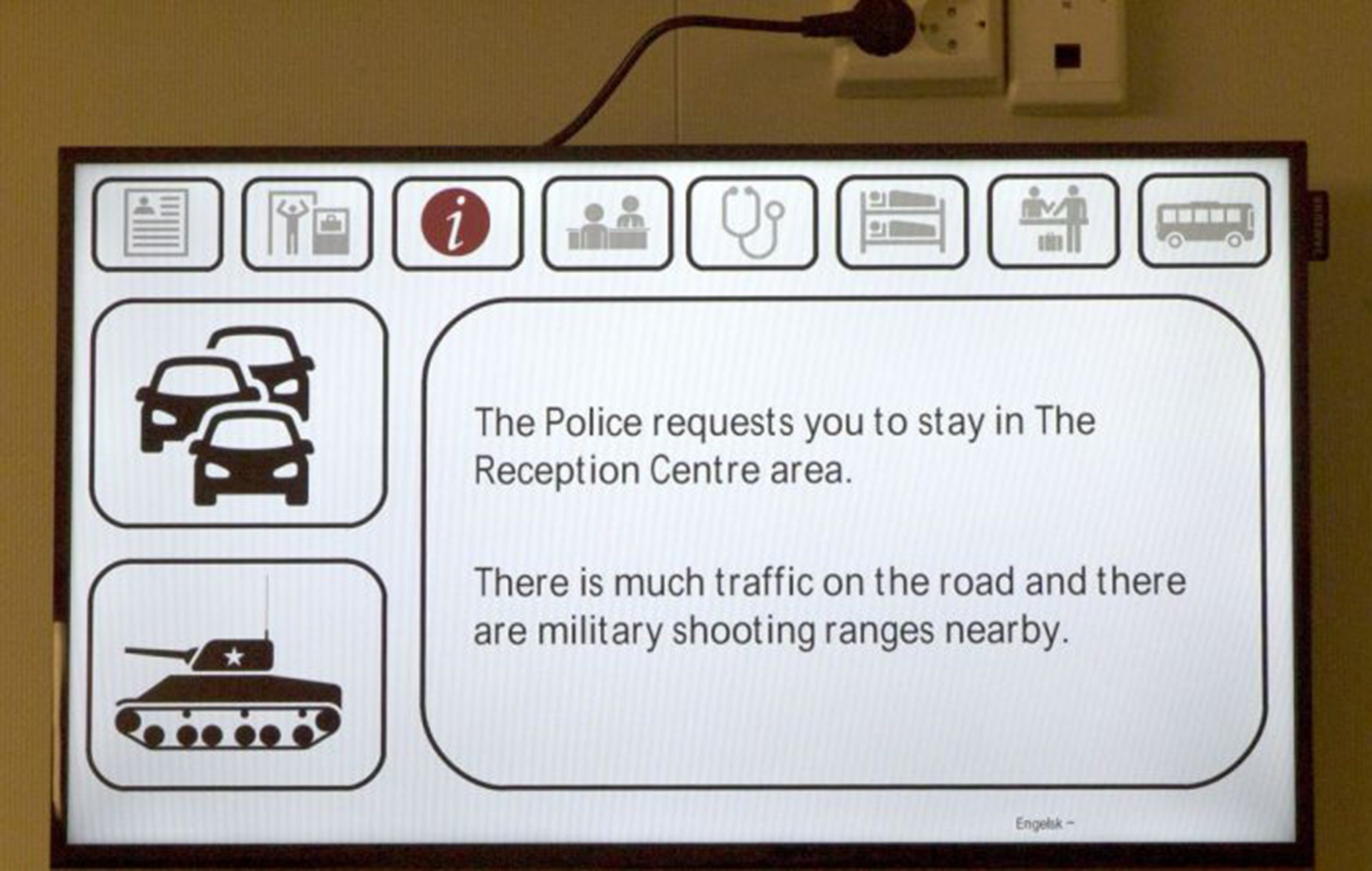 A screen displaying instructions at the new refugee centre in Kirkenes