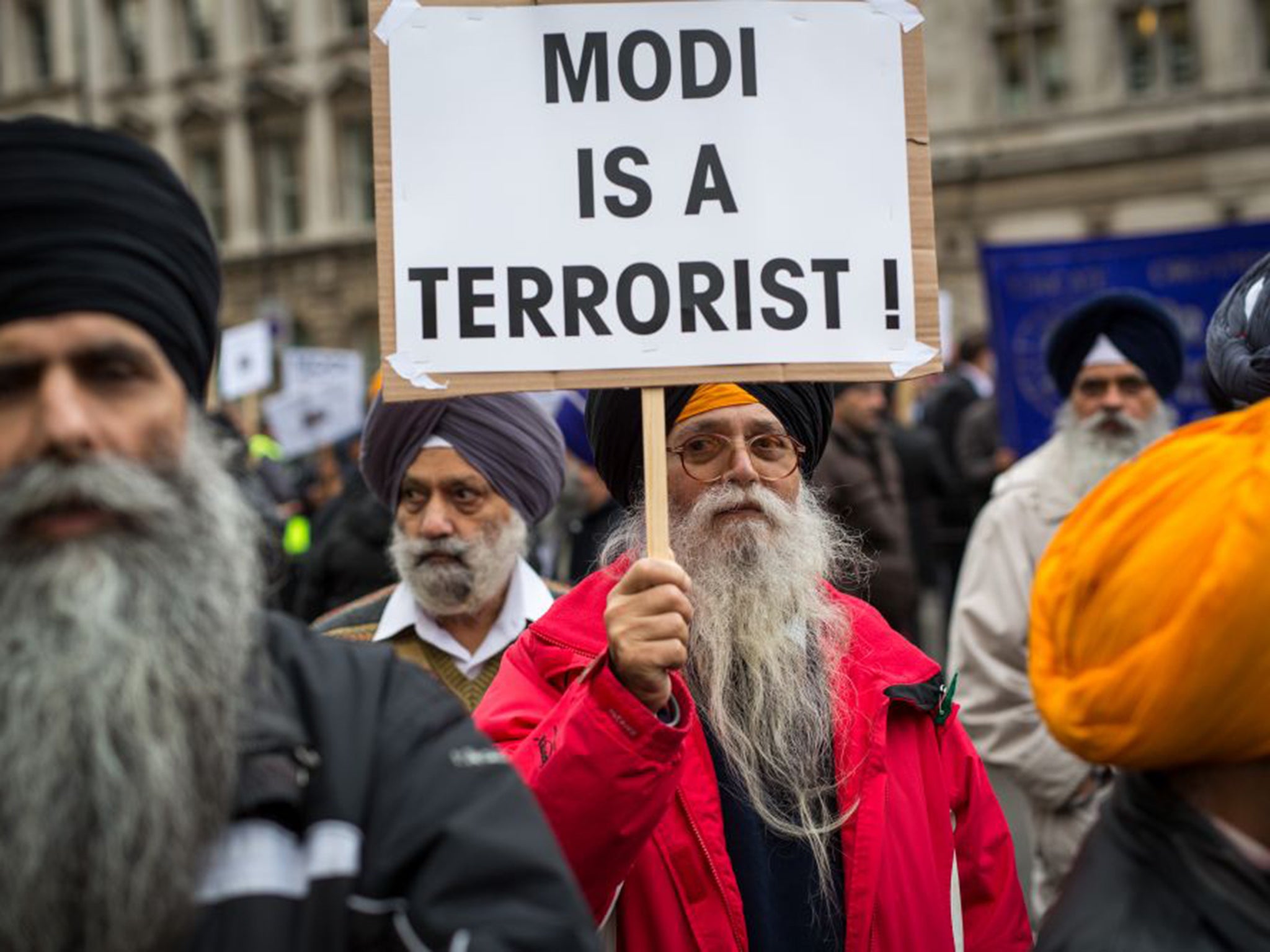 Protesters demonstrate against the Indian Prime Minister outside Downing Street