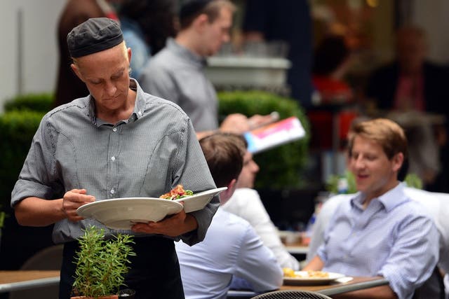 Waiting staff are among those who live with insecure employment in Britain's flexible economy