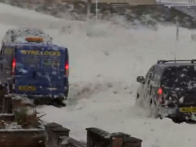 Cars were forced to plough through the deep foam, which looked like thick snow