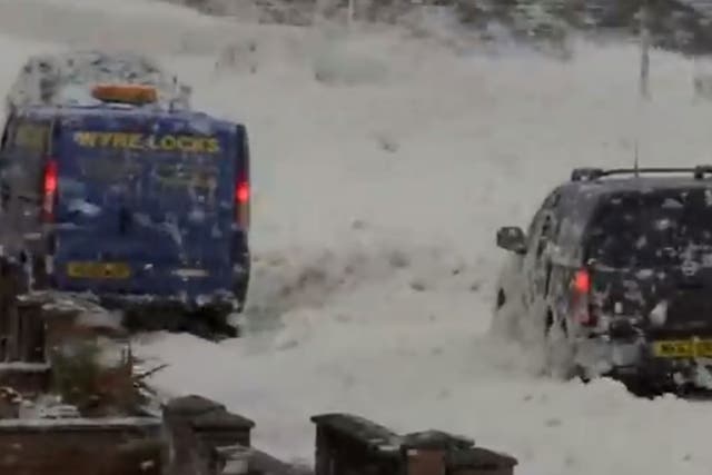 Cars were forced to plough through the deep foam, which looked like thick snow