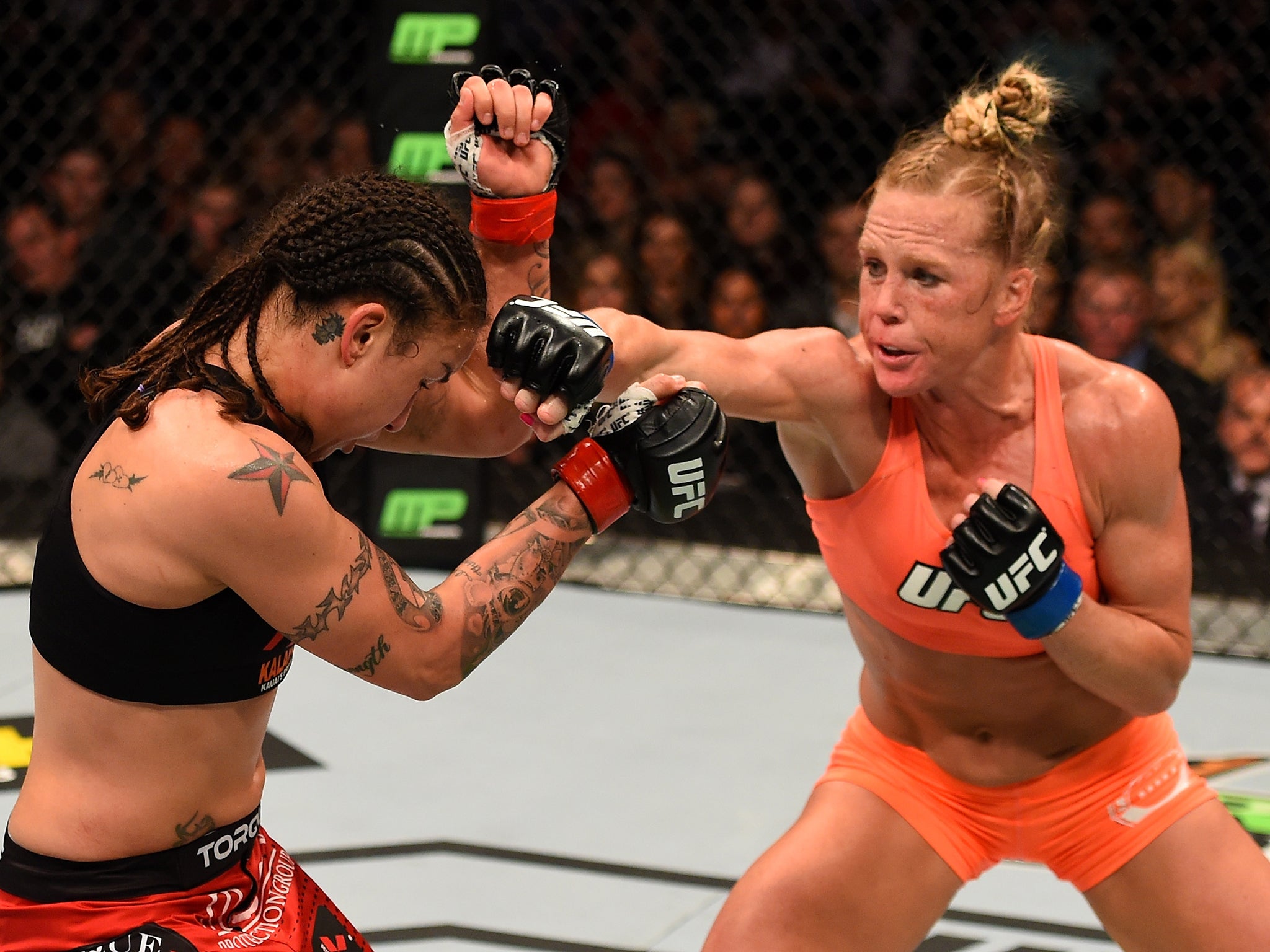 &#13;
Holly Holm (right) has made an impressive move from boxing to MMA &#13;