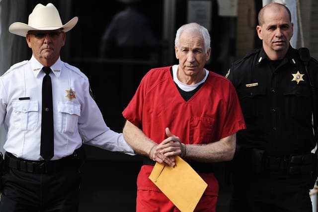 <p>Jerry Sandusky leaves a Pennsylvania courthouse in in 2012.</p>