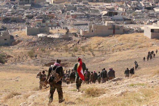 Kurdish peshmerga forces secured several strategic facilities in the northern Iraqi town of Sinjar on Friday