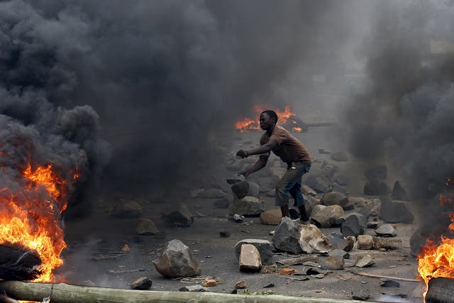 A protester sets up a  barricade during a protest against Burundi President Pierre Nkurunziza
