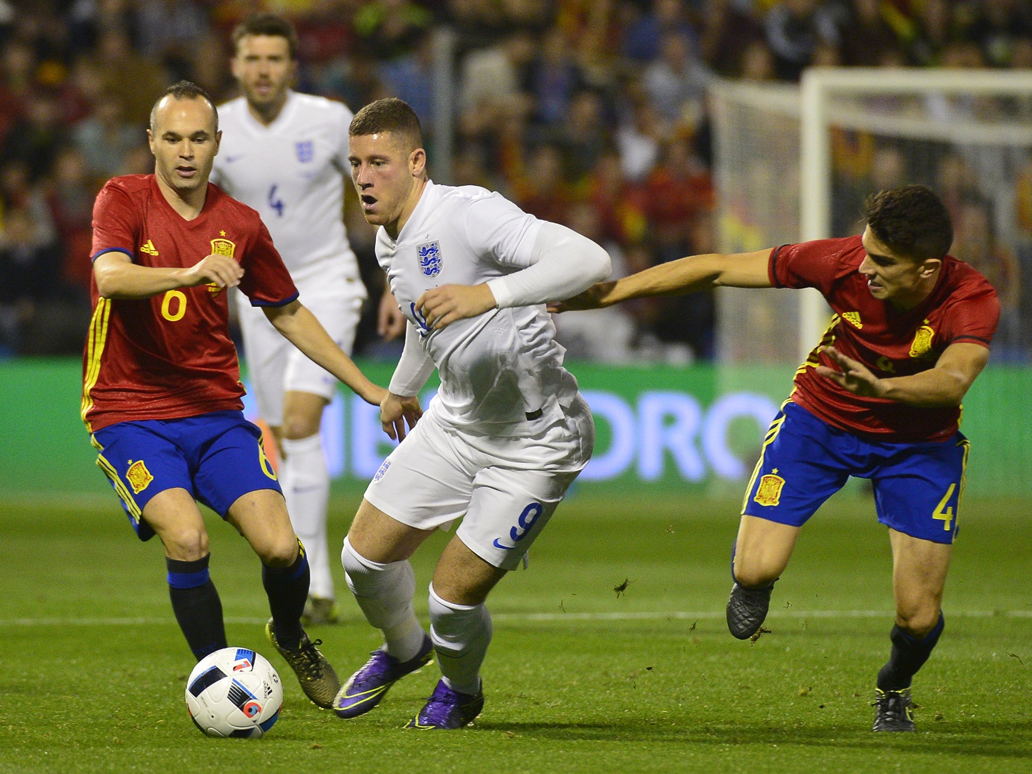 Ross Barkley vies with Andres Iniesta