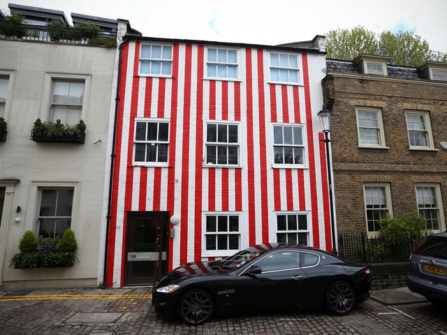The townhouse that was painted in red and white stripes by Zipporah Lisle-Mainwaring after a planning dispute with her neighbours